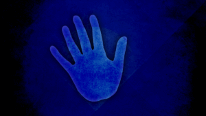 A hand reaching forward to prevent a negative action