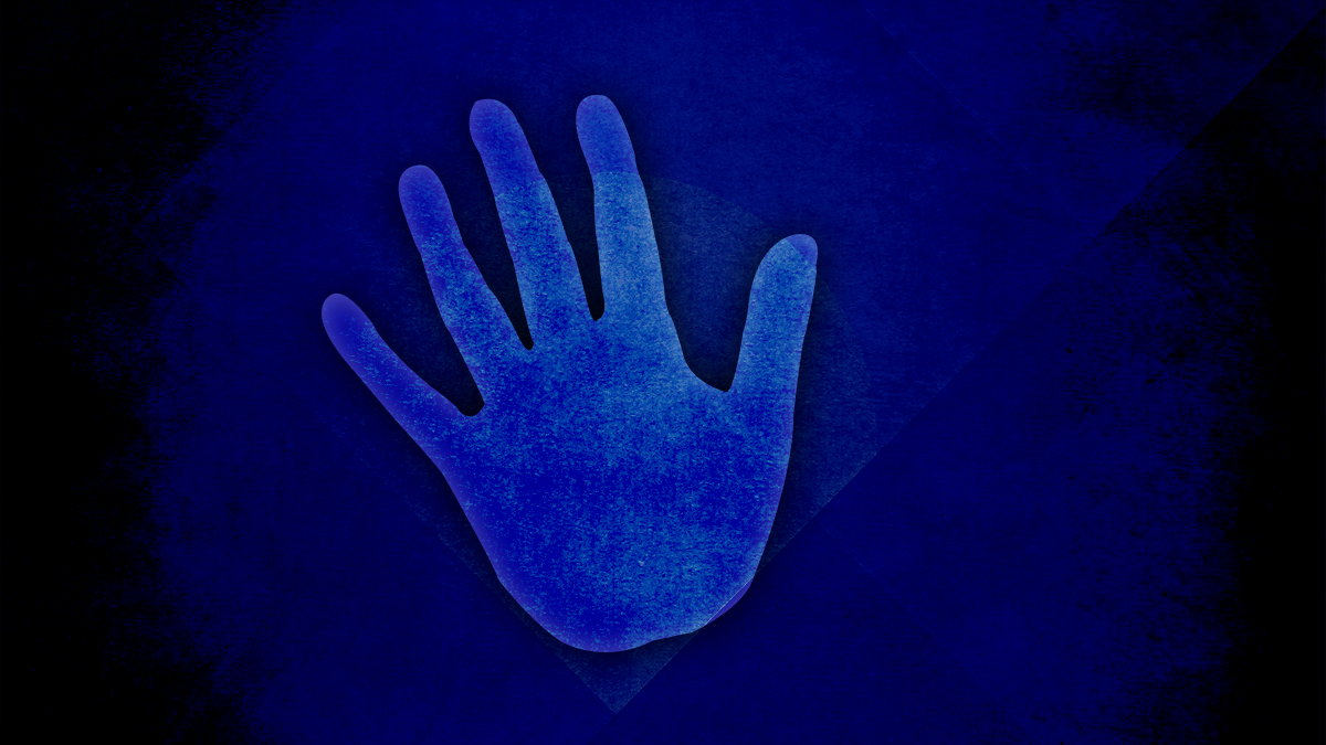 A hand reaching forward to prevent a negative action